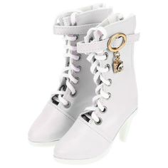 a pair of white high heeled boots with gold buckles