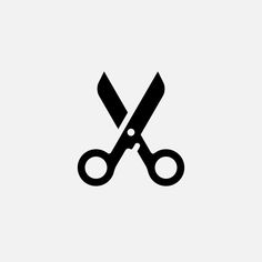 a pair of black scissors on a white background