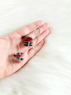 Beautiful red coral earrings. Made out of stainless steel, aluminum and red coral. Finished with stainless steel earring hooks.Length: 6 cmPackage will be shipped out as soon as I possibly can which is usually 3 - 5 days after the purchase. Don't hesitate to contact me if you have any question.Thanks for stopping by and don't forget to check my other items. Join Pevalek Jewellery at https://www.facebook.com/PevalekJewellery Red Metal Drop Earrings, Modern Red Teardrop Jewelry, Red Metal Dangle Earrings, Red Metal Earrings, Red Minimalist Dangle Earrings, Modern Red Pierced Jewelry, Single Red Sterling Silver Earring, Modern Red Metal Jewelry, Modern Red Pierced Earrings