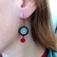 Lovely black Mandala earrings ♥

PLEASE, NOTE THAT THE STANDARD SHIPPING IS WITHOUT TRACKING (99% safe and reliable). YOU CAN CHOOSE A SHIPPING WITH TRACKING AT CHECKOUT.

→ MEASUREMENTS:

• Earrings 16 mm / 0.63" in diameter.
• Length : 50 mm / 1.97" in diameter

→ MATERIALS:

• High-quality picture is printed on waterproof paper and protected with a glass cabochon 
• All findings are Nickel Free. (zinc alloy)

→ PACKAGING:

• These earrings will be shipped in a gift box, ready for giving (or keeping!). 
• If you like to add a handwriting note please leave me a message with your order

• International: Please note, ALL international orders take anywhere from 2 to 4 weeks to arrive. It is not uncommon for it to take all 4 weeks. Please keep this in mind when ordering.

https://www.instagra Black Retro Handmade Jewelry, Retro Black Handmade Jewelry, Black Enamel Earrings, Pierced, Black Enamel Dangle Earrings For Gift, Gift Black Enamel Dangle Earrings, Black Enamel Pierced Earrings, Red Round Jewelry With Black Enamel, Handmade Black Enamel Earrings, Black Enamel Nickel-free Earrings