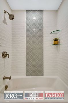 a bath tub sitting under a window next to a wall mounted shower faucet