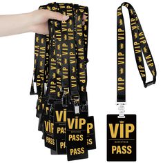 a hand holding a black and yellow lanyard with the words, viip pass on it