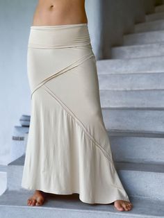 women's stretchy rayon jersey cream maxi skirt with raised stitch detail #color_cream Spring Fitted Skirt With Wide Waistband, Fitted Maxi Skirt With Wide Waistband For Spring, Chic Stretch Tiered Skirt, Elastane Maxi Skirt For Summer, Chic Fitted Tiered Maxi Skirt, Casual Wide Hem Fitted Bottoms, Versatile Solid Color Flared Maxi Skirt, Long Stretch Elastane Skirt, Stretch Elastane Long Skirt