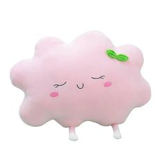 a pink pillow with a green leaf on it's head and eyes, sitting in front of a white background