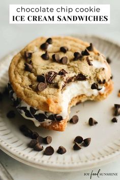 a chocolate chip cookie ice cream sandwich on a plate with oreo chips around it