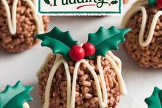 cookies decorated like christmas puddings with holly decorations