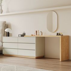 a living room with a white couch and a wooden dresser in front of a mirror