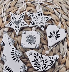 some white and black ornaments sitting on top of a basket