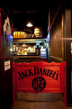 the entrance to jack daniels bar and grill at night