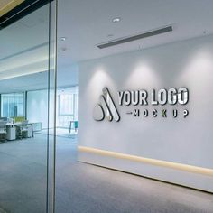 an office with glass walls and logo on the wall