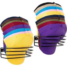 a pair of multicolored baseball caps sitting on top of a wire rack