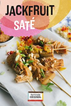 an advertisement for jackfrut sate with chicken and vegetables on skewers