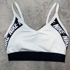 White Sports Bra With Black And White Logo And Mesh Back. Never Worn. Comes With Original Padding. White Athleisure Activewear For Sports, White Sports Bra For Workout, White Athleisure Sports Bra For Light Sports, White Medium Support Activewear For Sports, White Sports Bra With Light Support, White Sports Bra For Gym With Medium Support, White Sweat Resistant Sports Bra For Gym, White Athletic Fit Racerback Sports Bra, White Sports Bra For Light Sports