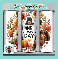 three cans with thanksgiving decorations on them and the words, happy thanksgiving written in black