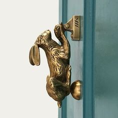 an image of a door handle with a dog on it