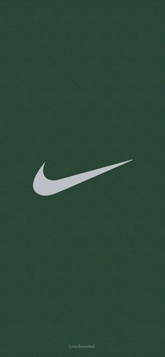 the nike logo is shown in white on a dark green background, and it appears to be made out of paper