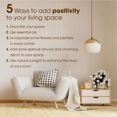 a living room with a couch and chair next to a wall that says 5 ways to add positivity to your living space