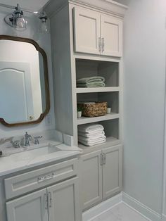 the bathroom is clean and ready to be used as a storage area for towels or other items