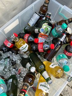 a bin filled with lots of different types of bottles