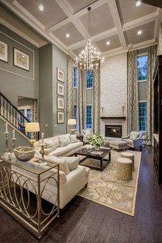 a living room filled with furniture and a fire place in the middle of a room