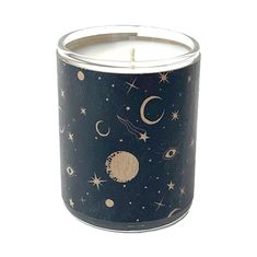 a black candle with stars and planets on it