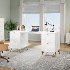 a white desk with gold legs and a laptop on it in front of two windows