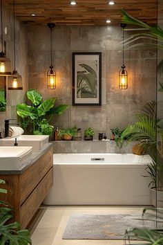 a bathroom with two sinks, a bathtub and plants in the corner on the wall