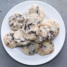 a white plate topped with chocolate chip cookies