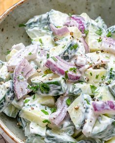 a bowl filled with potato salad and dressing