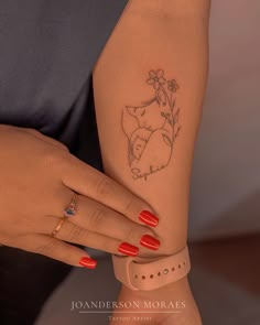 a woman's arm with a tattoo on it and a flower in the middle