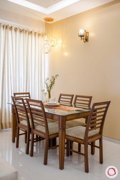 a dining room table with six chairs around it