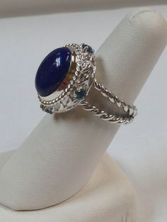 925 STERLING SILVER RING  BEAUTIFUL ONE OF A KIND RING LAPIS LAZULI IS 14x10 mm OVAL SHAPE SIDE STONES ARE NATURAL BLUE TOPAZ 3 mm EACH RING SIZE IS 7.25 WITH GIFT BOX Elegant Lapis Lazuli Ring With Polished Finish, Luxury Elegant Lapis Lazuli Rings, Luxury Lapis Lazuli Gift Ring, Carved Lapis Ring, Luxury Cabochon Lapis Lazuli Rings, Amethyst Studs, Lapis Lazuli Bracelet, Citrine Ring, Amethyst Earrings