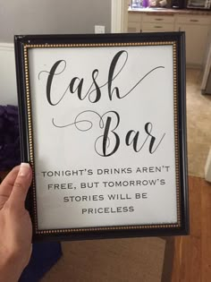 a person holding up a sign that reads cash bar tonight's drinks aren't free, but tomorrow's stories will be priceless