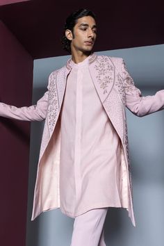 Pale pink open sherwani with heavy dori and glass bead embellishments all over. Paired with a kurta and pant.
Components: 3
Pattern: Embroidered
Type Of Work: Dori, Glass Bead
Neckline: Band collar
Sleeve Type: Long
Fabric: Japanese Suiting
Color: Pink
Other Details: 
Approx. product weight: 1.5 kgs
Occasion: Wedding - Aza Fashions Pink Sherwani With Mirror Work For Designer Wear, Bollywood Style Pink Sherwani With Mirror Work, Pink Bollywood Sherwani With Mirror Work, Pink Bandhgala With Resham Embroidery For Eid, Pink Fitted Bollywood Sherwani, Pink Bandhgala With Zari Work For Eid, Pink Sherwani With Resham Embroidery In Traditional Drape, Pink Traditional Bandhgala For Designer Wear, Traditional Pink Bandhgala For Designer Wear