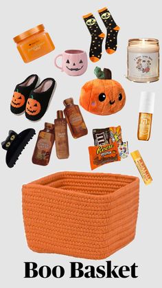 an orange basket filled with halloween items and text that says boo baket on it