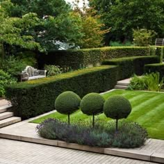 the garden is neatly trimmed and ready to be used as a focal point for this photo