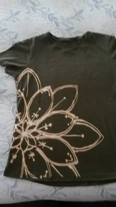 a t - shirt with an image of a flower on it