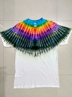 a t - shirt with multicolored tie dye on it