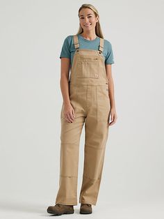 BUILT FOR ANYTHING For hard-working women on the move, the Women's Wrangler® RIGGS WORKWEAR® Relaxed Work Overall is the perfect companion. Combining fashion and function with rough and tumble craftsmanship, this relaxed-fit, loose leg cotton overall handles your toughest days with ease, with just enough stretch to always move with you. With adjustable straps and workwear favorite features, including a zippered chest pocket, zippered back thigh pocket, a utility thigh pocket, double-layered knee Hard Working Women, Womens Cowgirl Boots, Work Pants Women, Working Women, Bib Overalls, Hard Working, Overalls Women, Tigers Eye, Tape Measure