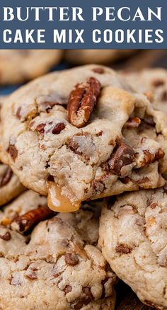 a pile of cookies sitting on top of a blue plate with pecans in the middle