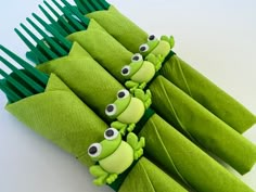 a group of green toothbrushes with eyes on them