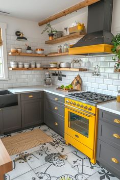 a yellow stove top oven sitting inside of a kitchen