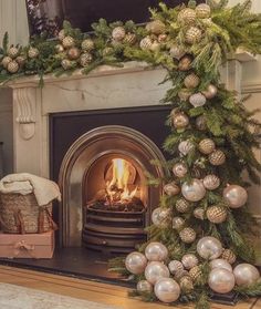 a fireplace decorated for christmas with ornaments and presents