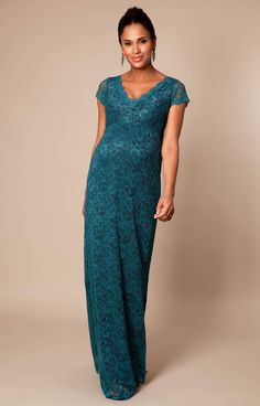 Modern and elegant with a hint of vintage, our Laura Lace Maternity Gown in rich Ocean Green has all the glamour of a red carpet occasion dress. Designed to emphasise a feminine silhouette, with a scalloped v neck-line and sexy split to the knee, this dramatic maternity gown with turn heads at every occasion. Maternity Dress Wedding, Rose Tiffany, Maternity Dress Wedding Guest, Pregnancy Fashion Fall, Lace Maternity Gown, Wedding Guest Accessories, Maternity Dresses For Baby Shower, Formal Maternity Dress, Tiffany Rose