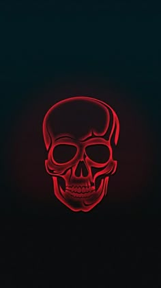 a red neon skull in the dark with its head turned to look like it is glowing