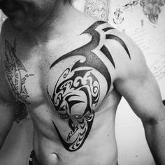 a man with a tattoo on his chest