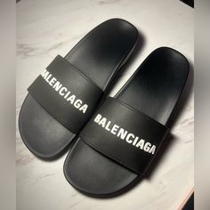 Worn A Few Times But Pretty Much Look New. Super Easy To Clean And Comes With Box. Box Is Slightly Damaged On The Side. Black Logo-Embossed Strap Open Toe Slip-On Style Low Block Heel Rubber Sole. Not Accepting Low Ball Offers:) Balenciaga Slides, Black Balenciaga, Balenciaga Black, Balenciaga Shoes, Low Block Heels, Slipper Sandals, Luxe Fashion, Mens Slippers, Bags Designer Fashion