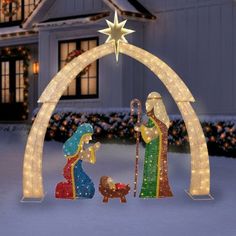 lighted nativity scene in front of a house