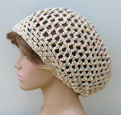 a mannequin head wearing a crocheted hat