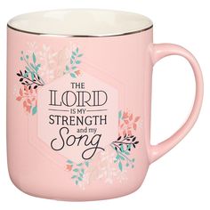 the lord is my strength and my song pink coffee mug with floral design on it